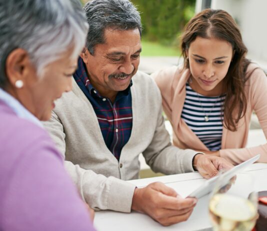 ESTATE PLANNING AND CAREGIVERS senior man showing family documents
